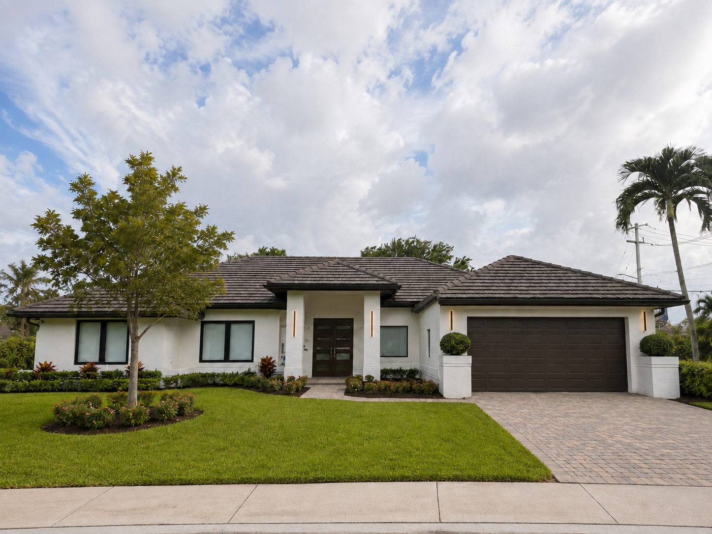 Mora Realty Davie real estate agent Davie FL — modern single-story home with tile roof and manicured lawn